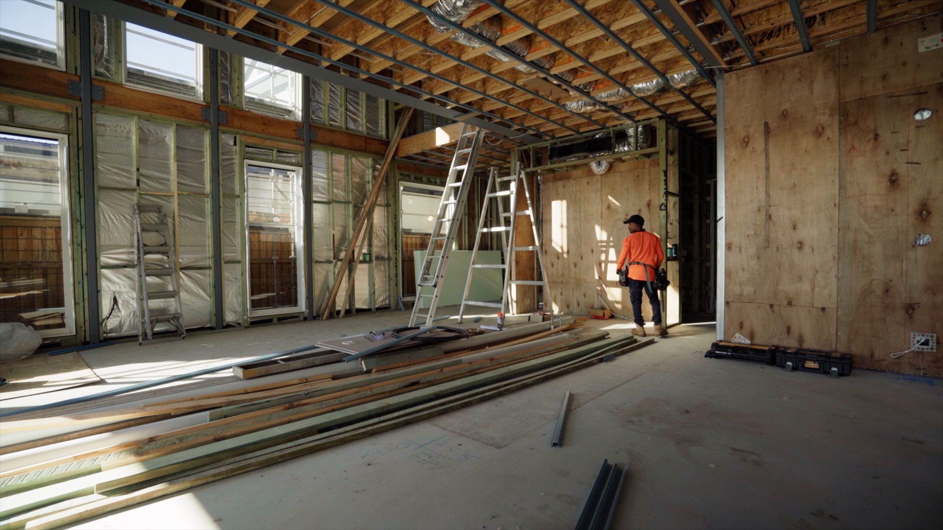 A custom home under construction, framed and lined