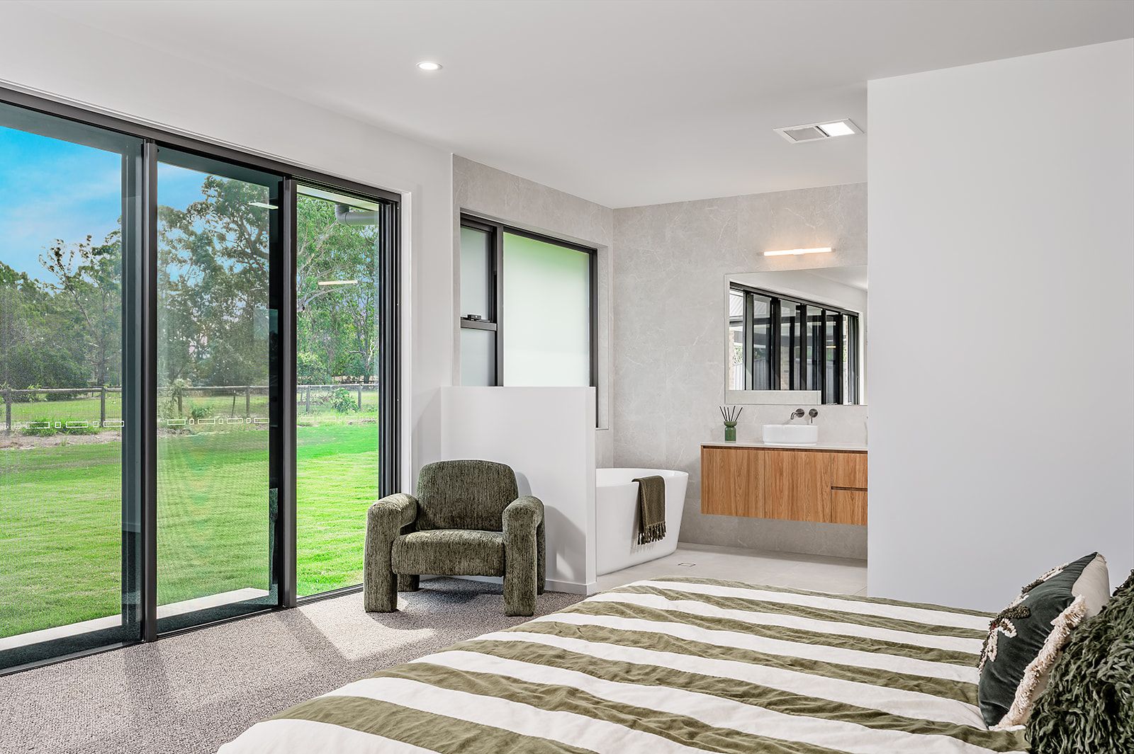 Main bedroom with sliding doors out to the acreage