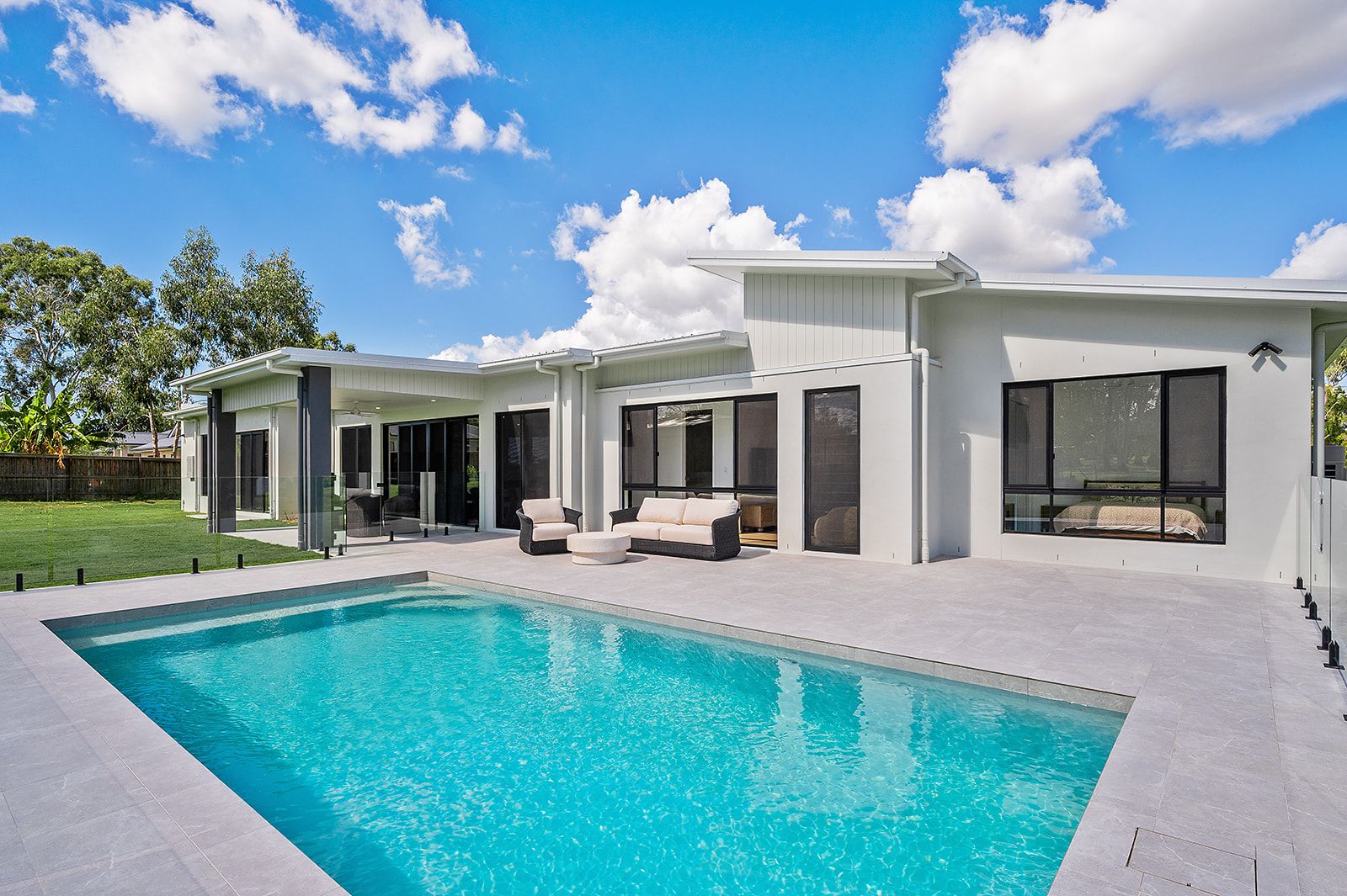 Pool and covered alfresco at the back of the Fernbrook